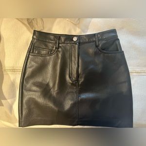 This is a vegan high-waisted mini skirt.
